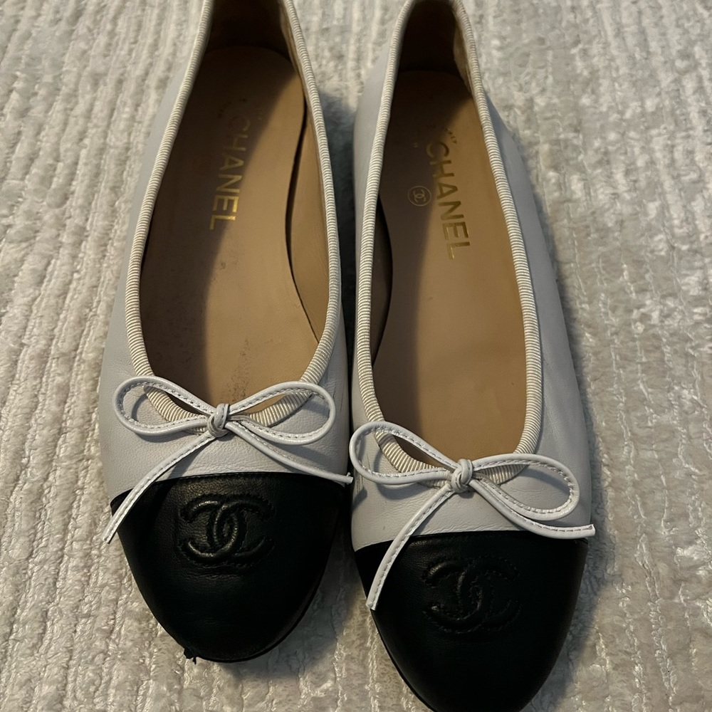 Chanel white and black flats.